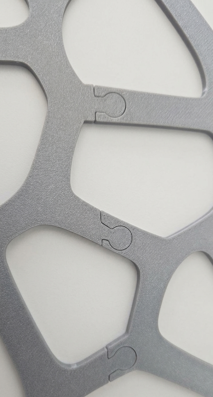 giraffe pattern panel connectors for a decorative panel laying on a flat surface